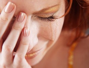 Closeup of crying woman with tears