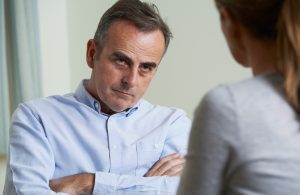 Depressed Mature Man Talking To Counsellor